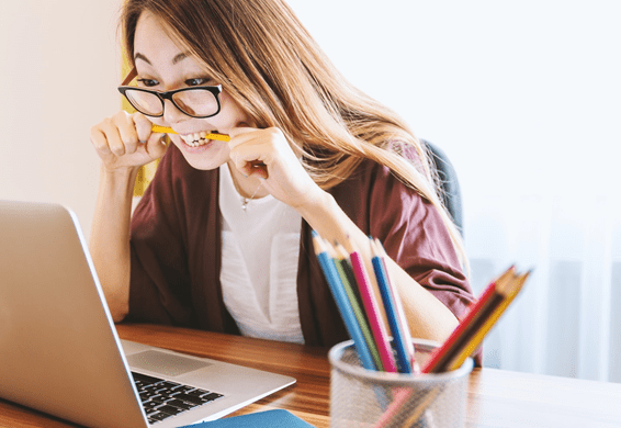 Woman with glasses stressing over buying a home for the first time.