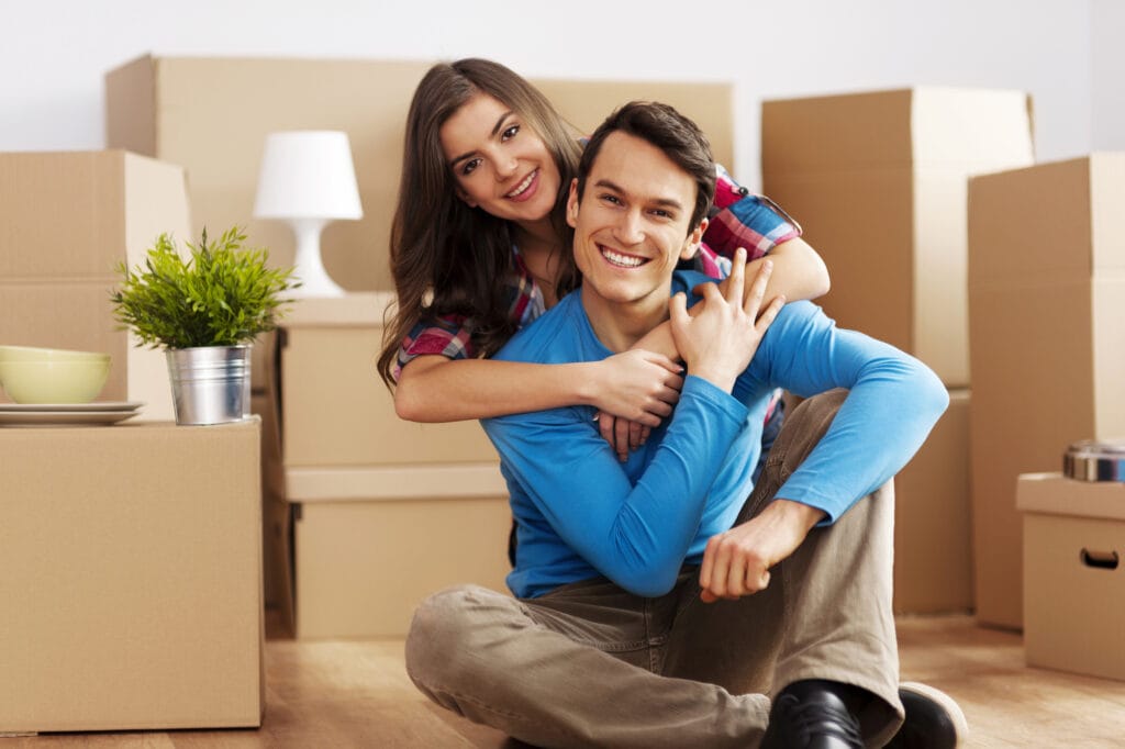 portrait of happy couple in new home